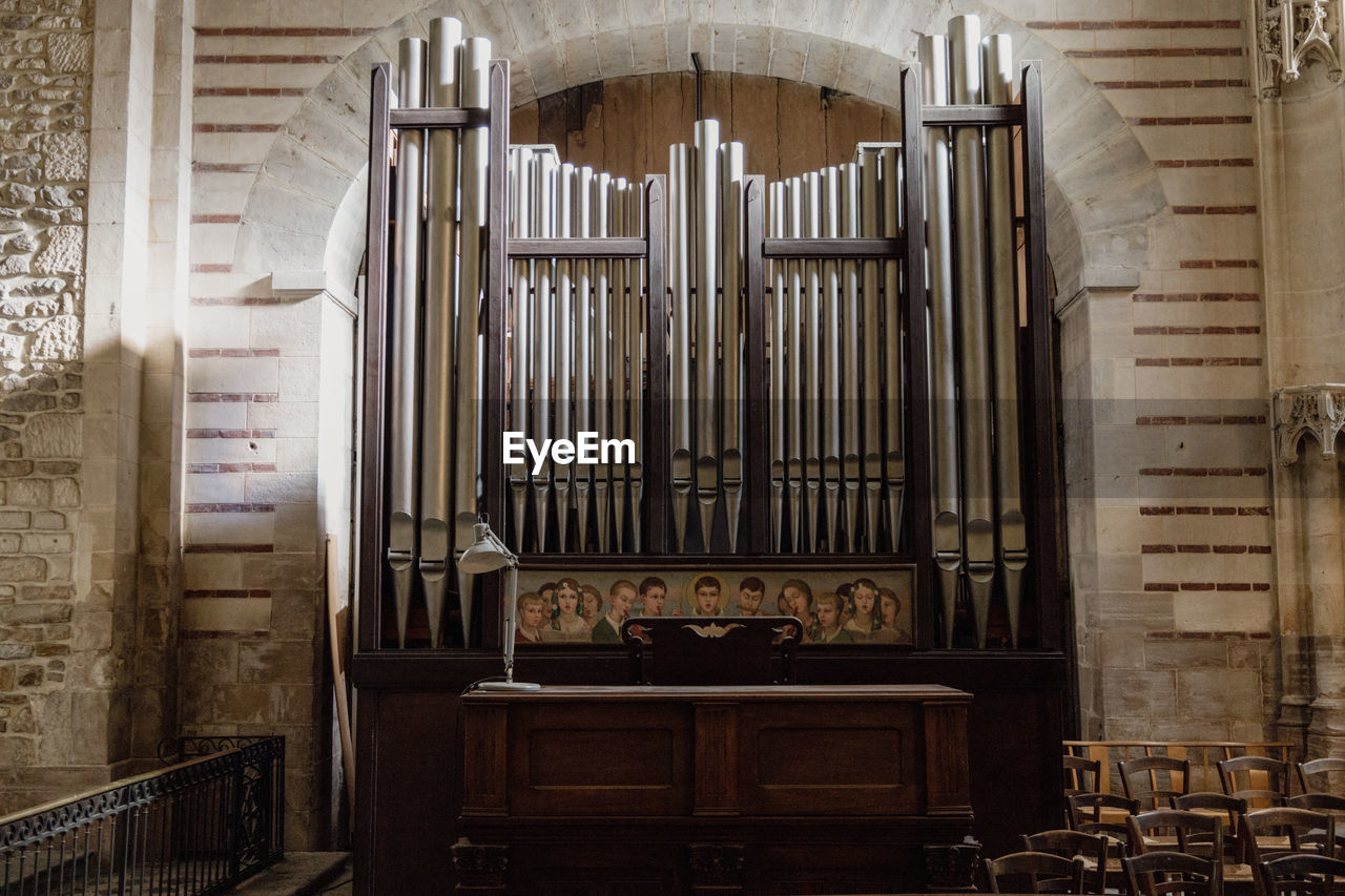 architecture, pipe organ, music, musical instrument, place of worship, religion, built structure, building, keyboard, indoors, spirituality, belief, electronic device, arts culture and entertainment, wind instrument, history, organ pipe, musical equipment, no people, the past, worship, catholicism