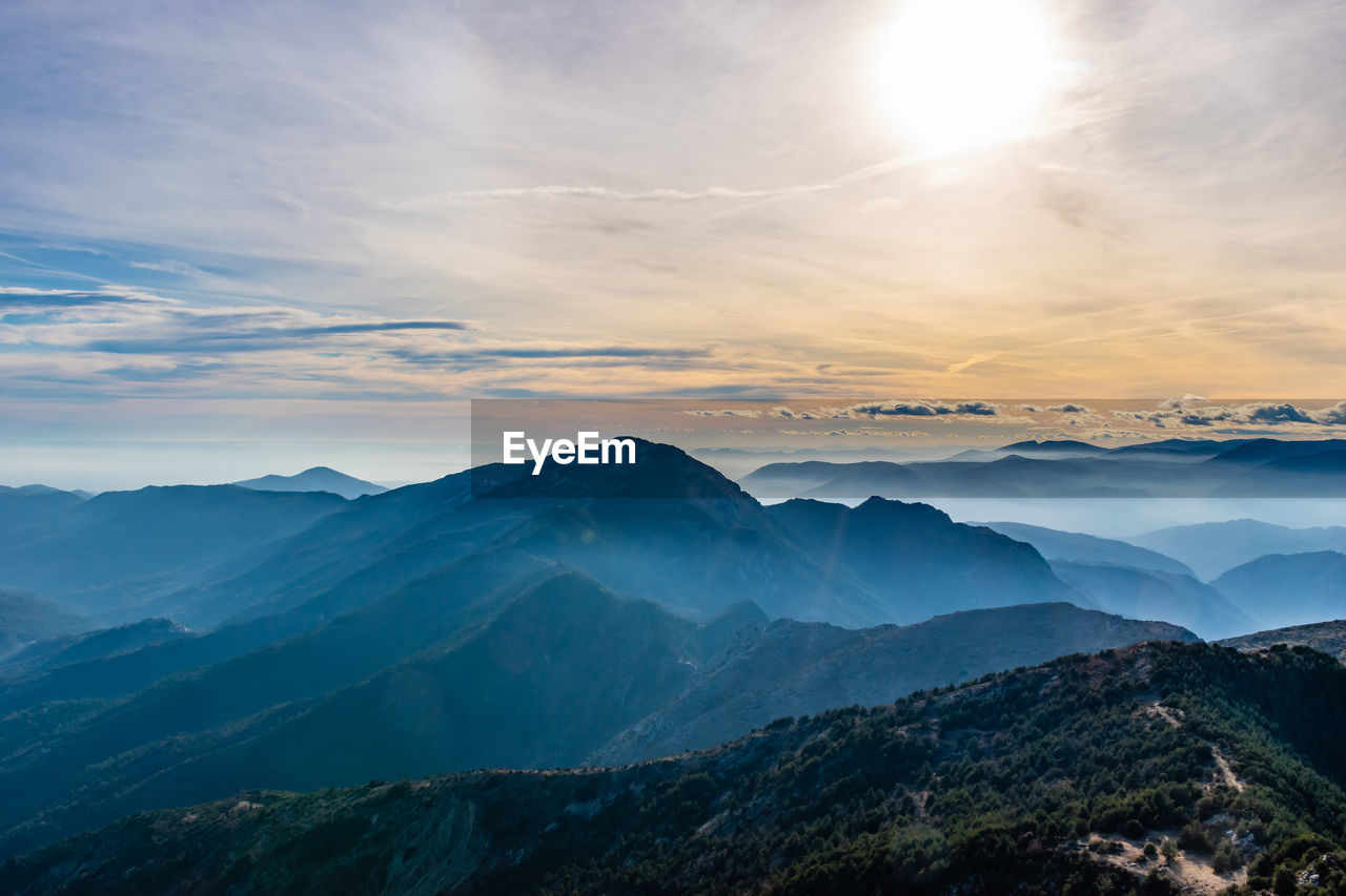 Scenic view of mountains against sky during sunset