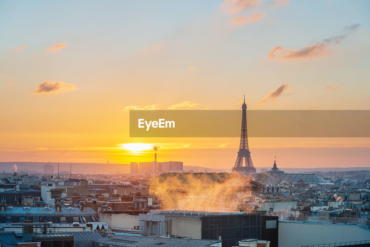 BUILDINGS AGAINST SKY DURING SUNSET