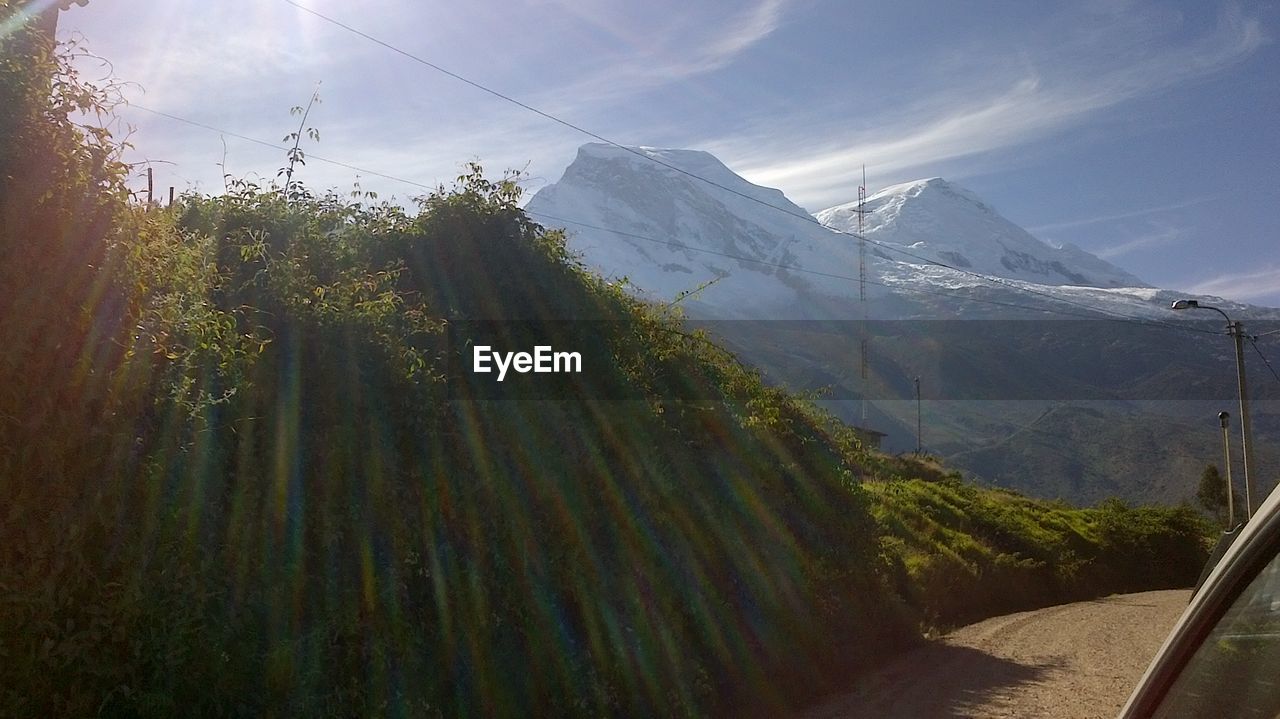 PANORAMIC SHOT OF SNOWCAPPED MOUNTAIN AGAINST SKY