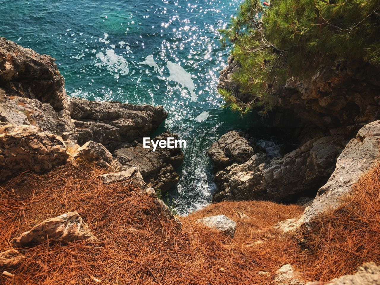 High angle view of rock formation by sea