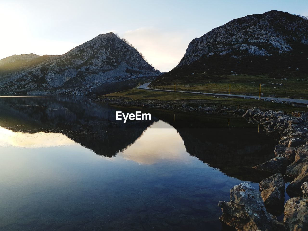 Scenic view of lake and mountains against sky