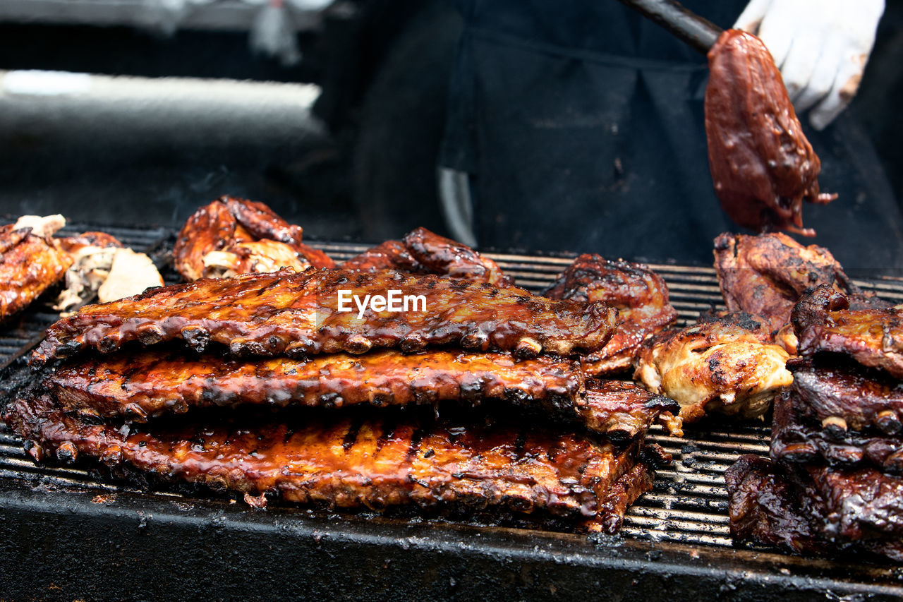 Barbecue ribs and chicken on the grill at a summer festival