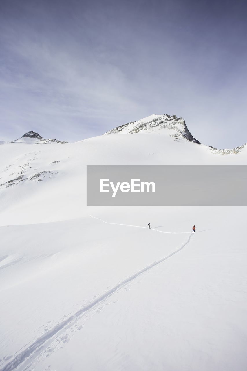 Scenic view of snow covered mountain against sky