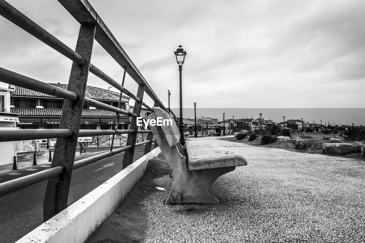 sky, black and white, cloud, architecture, monochrome, monochrome photography, built structure, nature, water, white, transportation, bridge, city, no people, walkway, outdoors, travel destinations, day, urban area, black, building exterior, travel, sea, mode of transportation, land