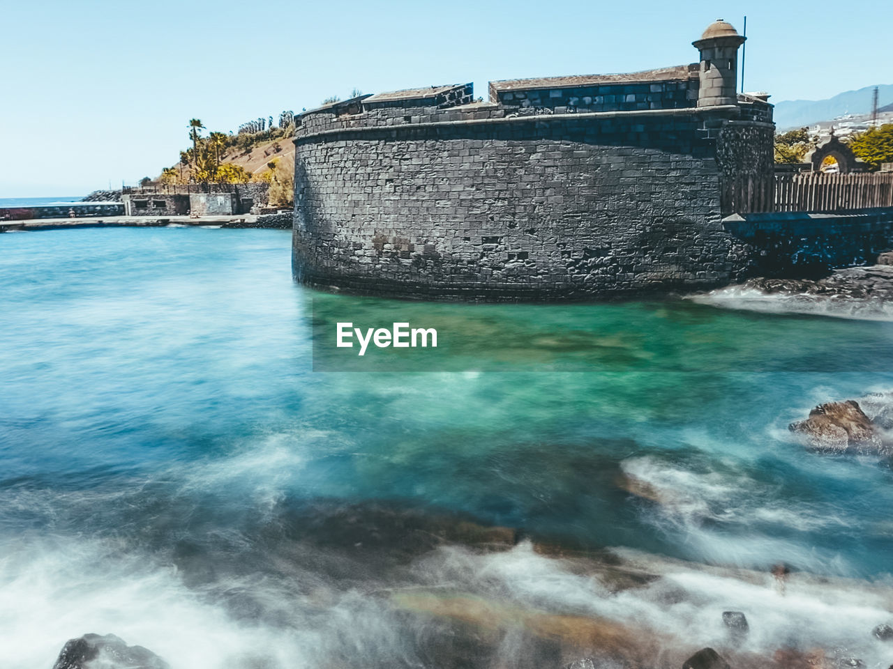 VIEW OF SEA AGAINST BUILDING