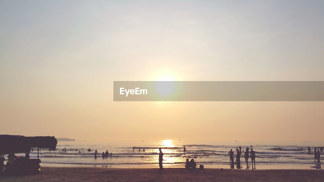 Scenic view of beach and sea against sky during sunset