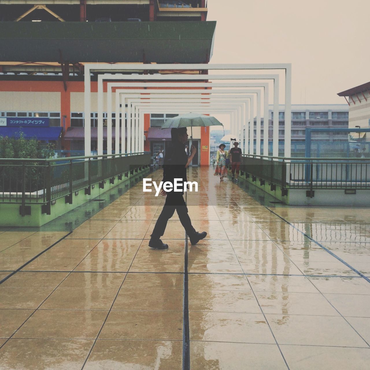 View of man walking in rain