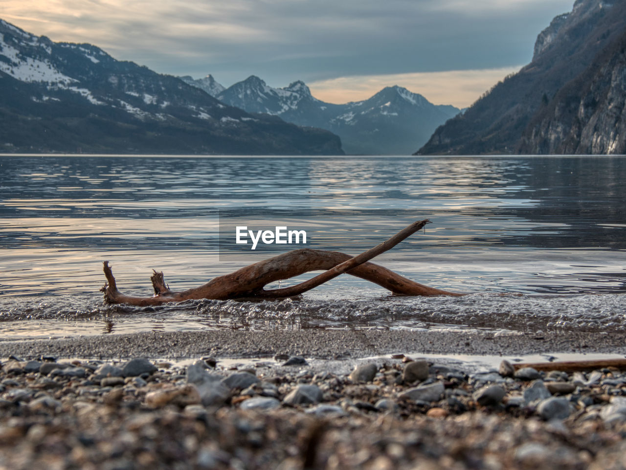 SCENIC VIEW OF LAKE AND SNOWCAPPED MOUNTAINS