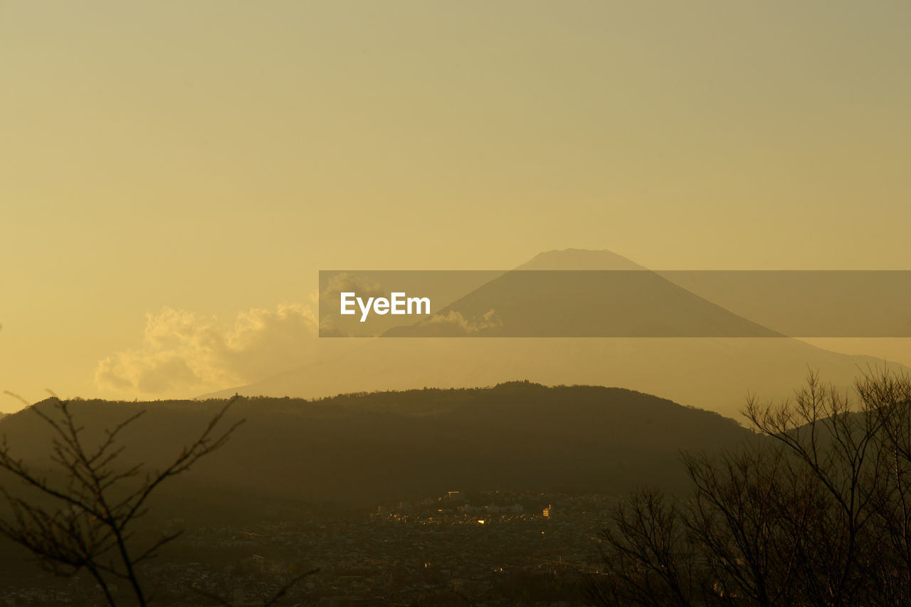 Scenic view of silhouette mountains against sky during sunset