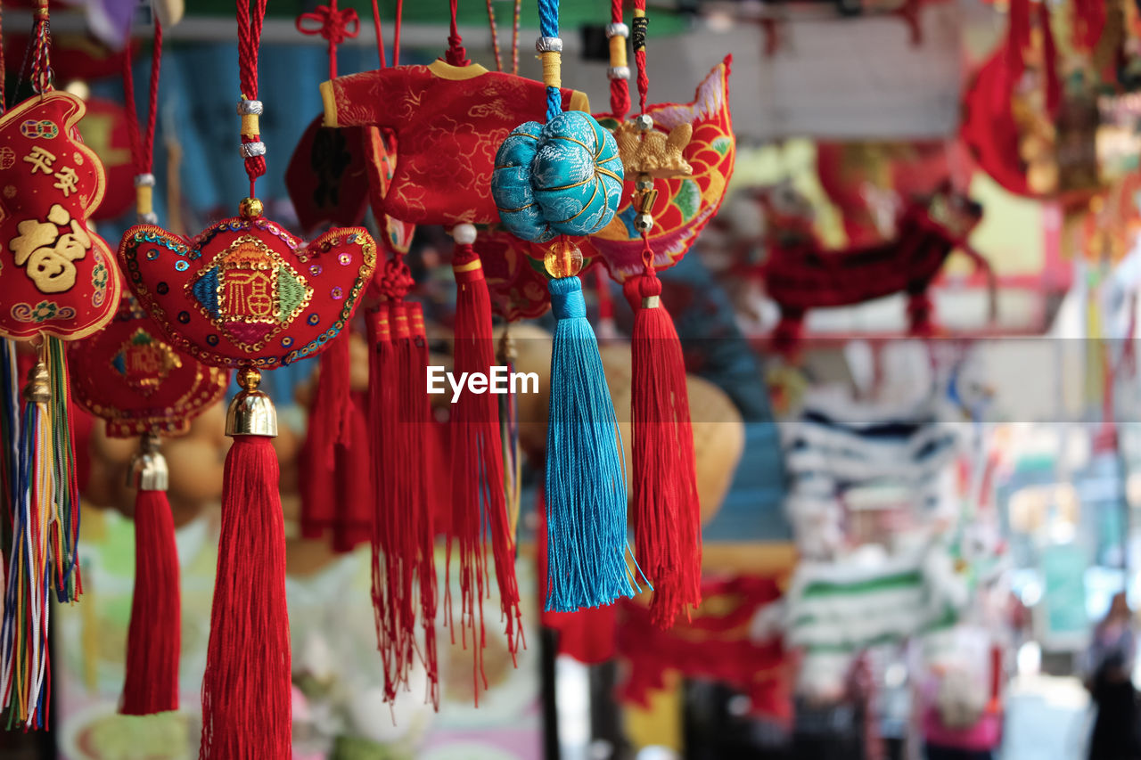 Close-up of chinese decoration hanging for sale at market stall 