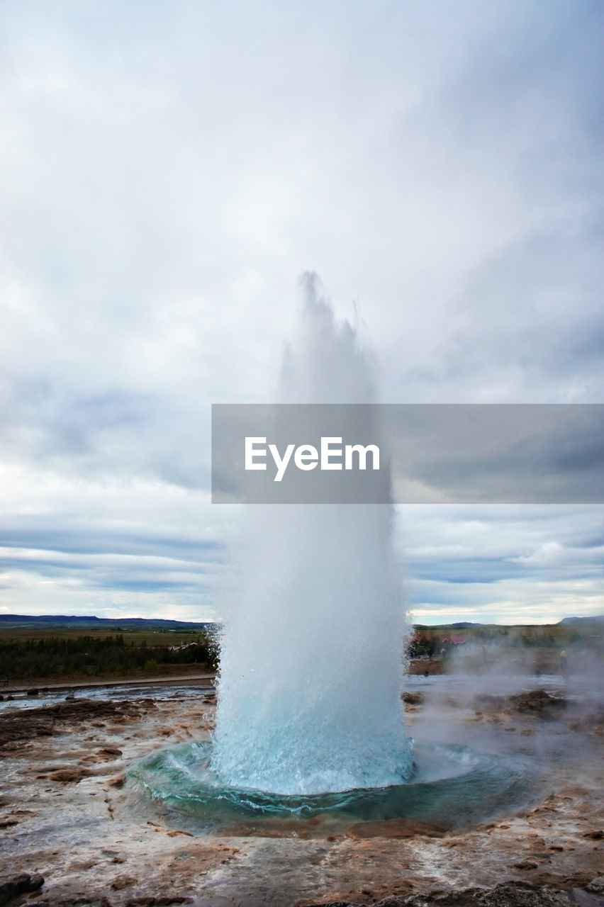 The great geysir, geyser in southwestern iceland, haukadalur valley, geyser splashing out of ground 