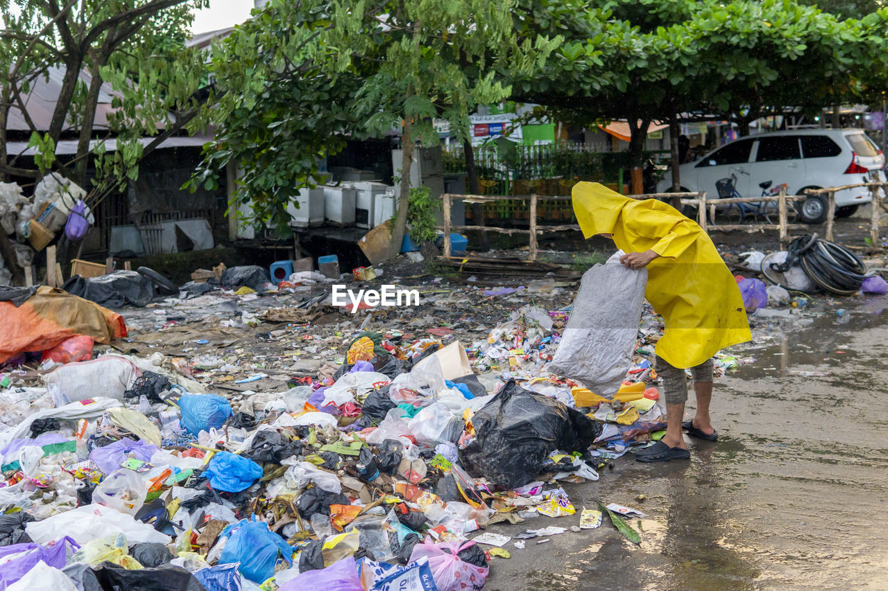 Sanitation worker picking up garbage