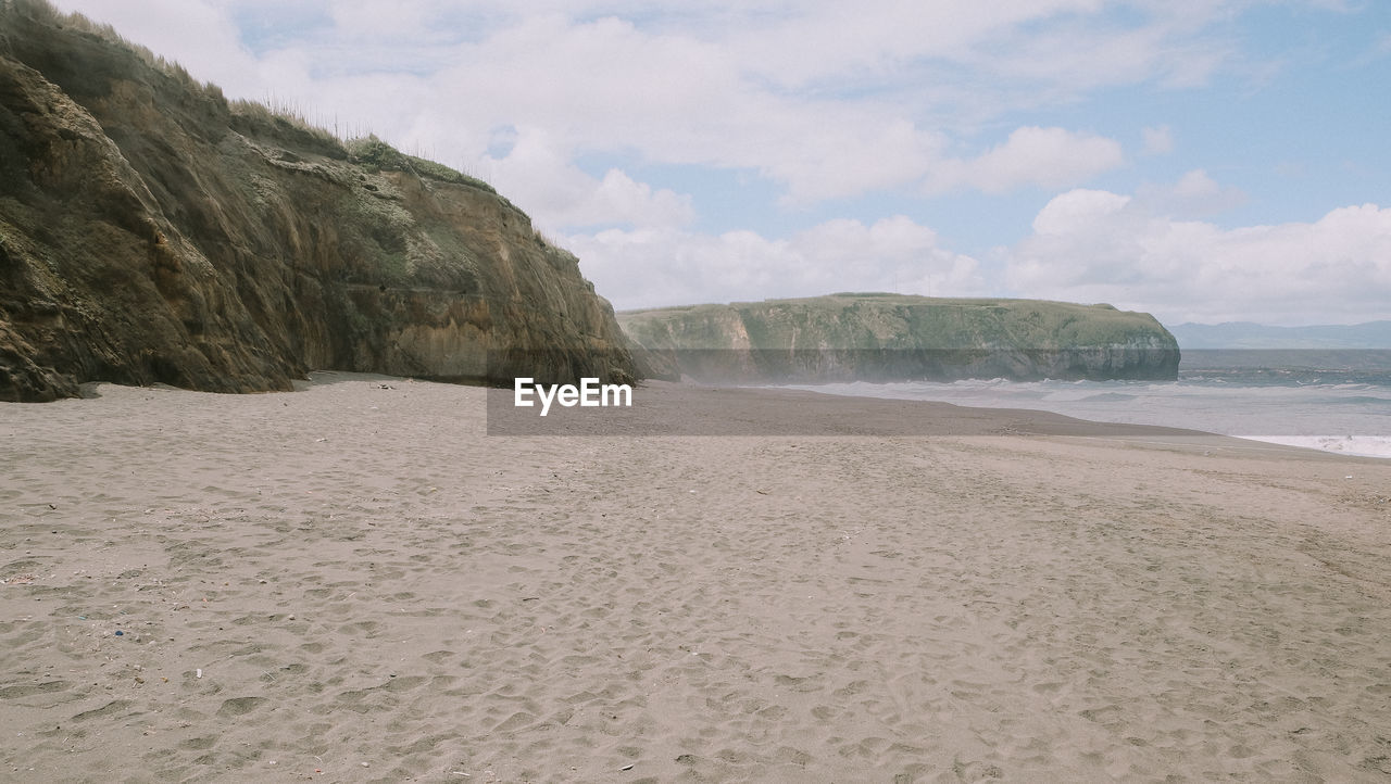 Scenic view of beach against sky