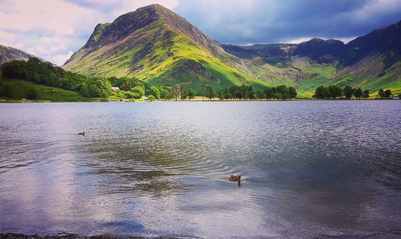 SCENIC VIEW OF LAKE WITH MOUNTAINS IN BACKGROUND