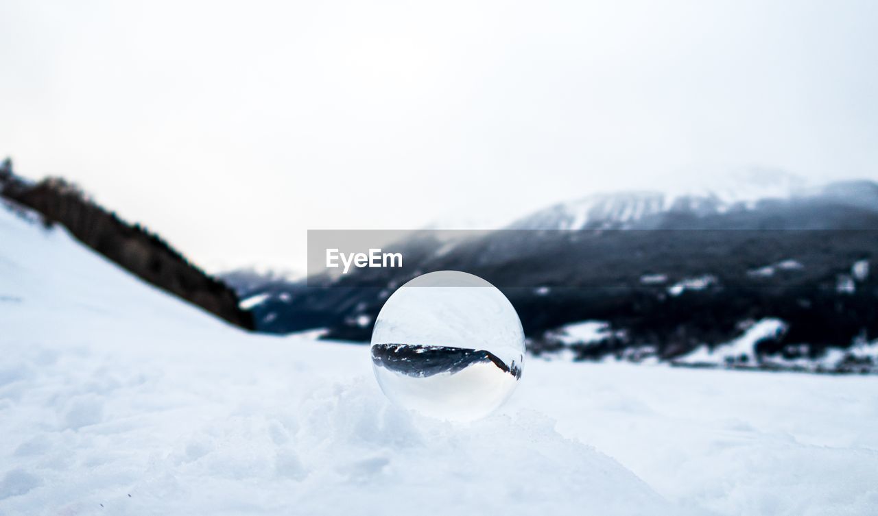 CLOSE-UP OF SNOW ON FIELD