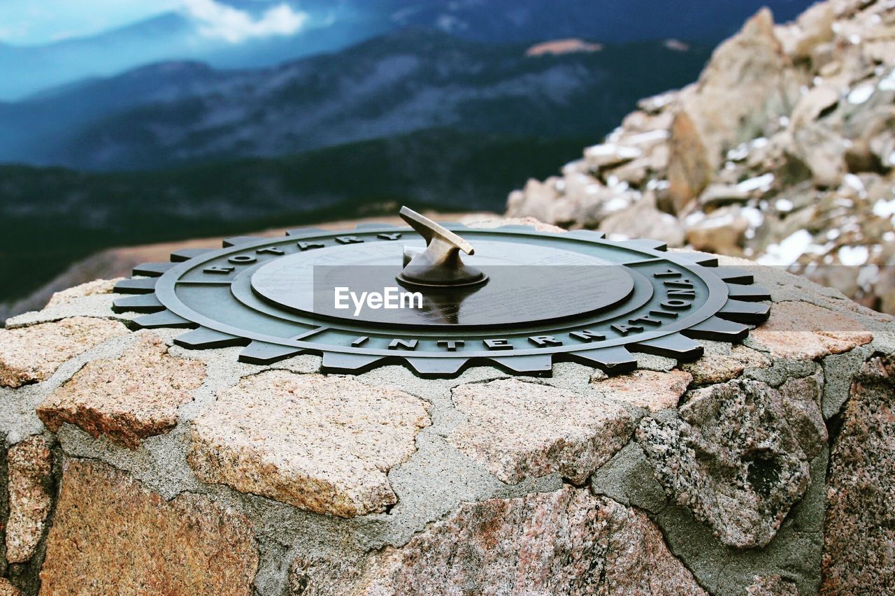 High angle view of rotary international sign on rocky mountain