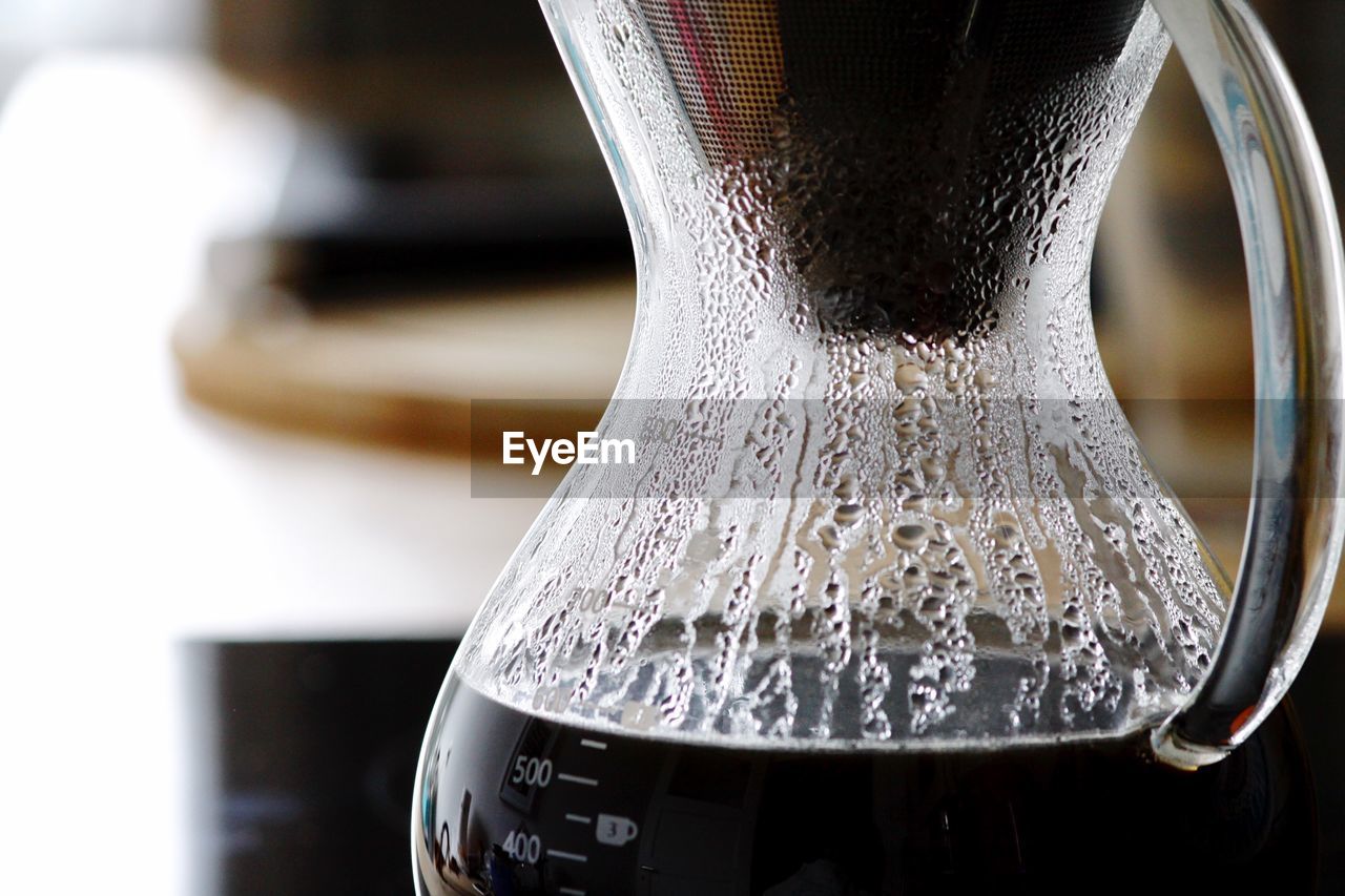 Close-up of coffee maker on table