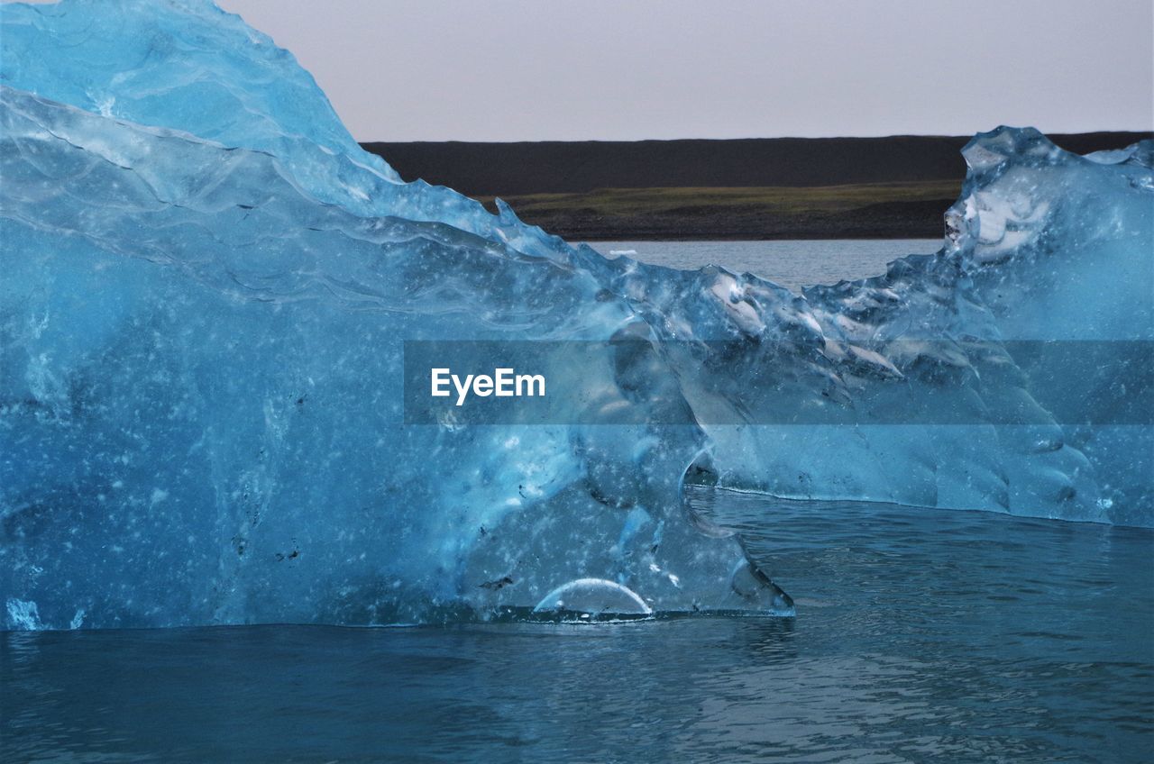 Scenic view of frozen sea against sky