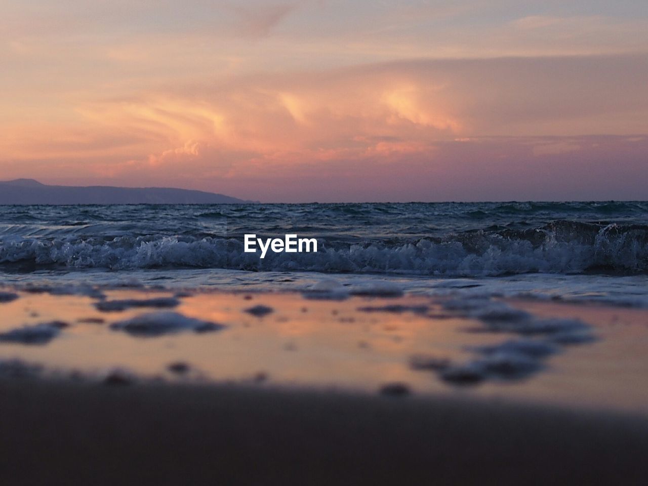 Surface level view of shore against sky