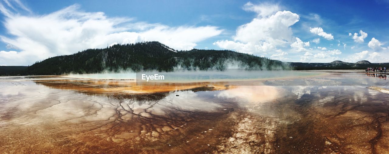 Panoramic view of lake against cloudy sky