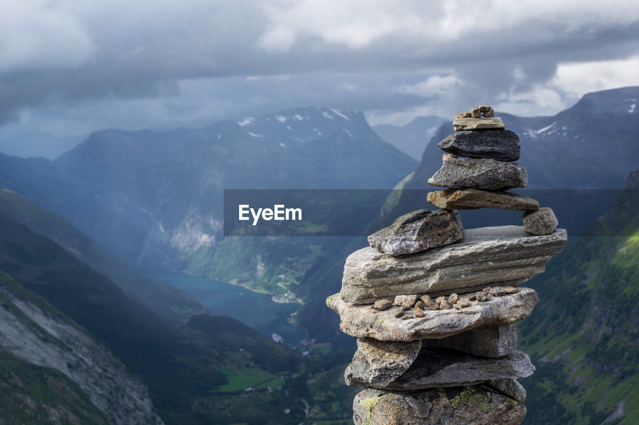 Scenic view of rock stack against mountain range