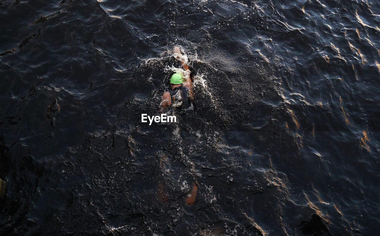 High angle view of person swimming in sea