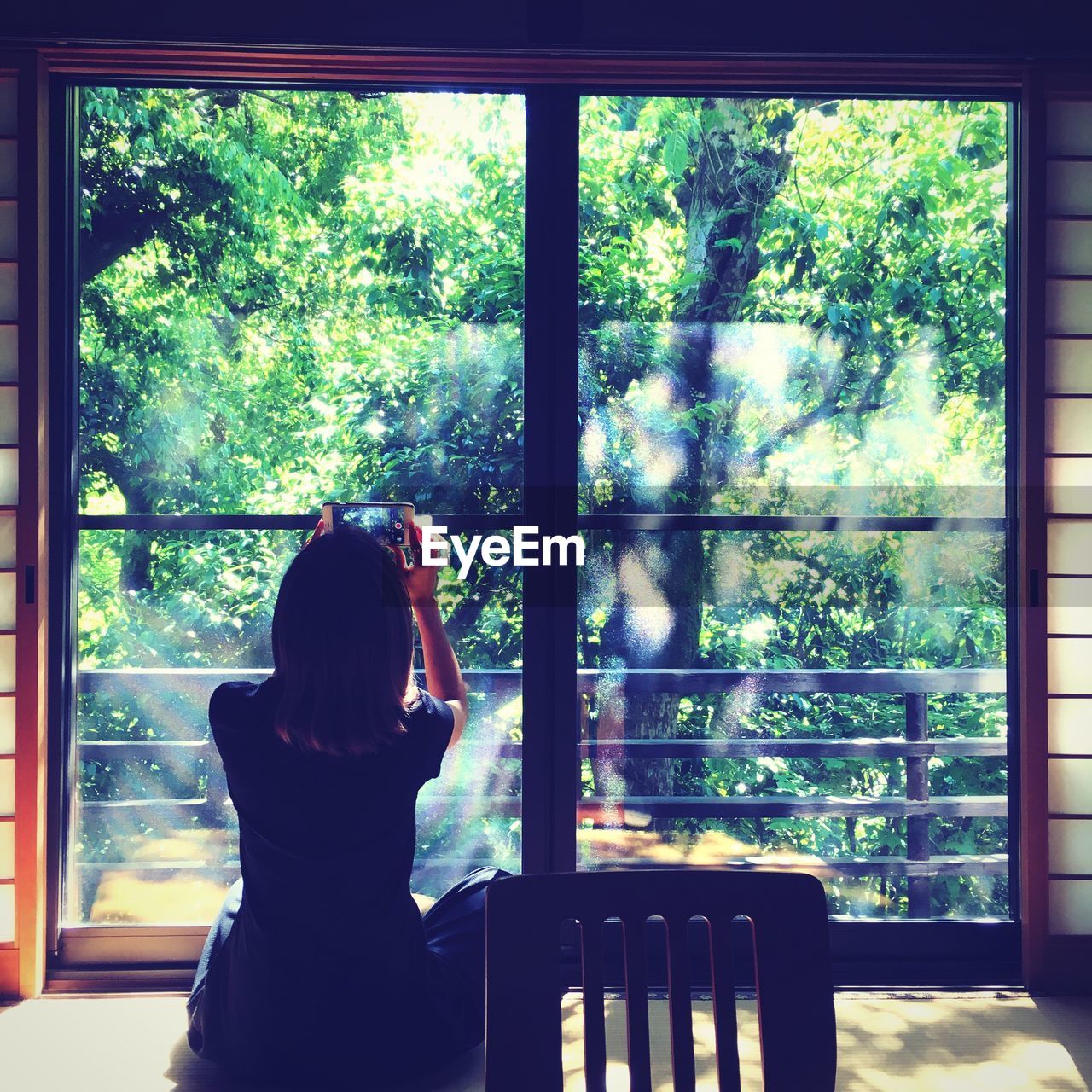 VIEW OF PEOPLE SITTING ON WINDOW