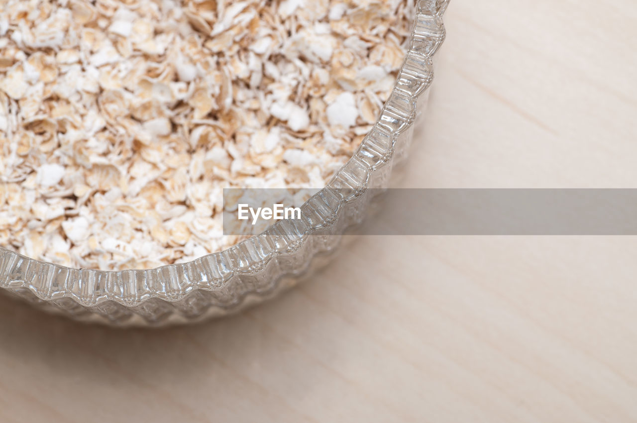 CLOSE-UP OF BREAD ON WOODEN TABLE