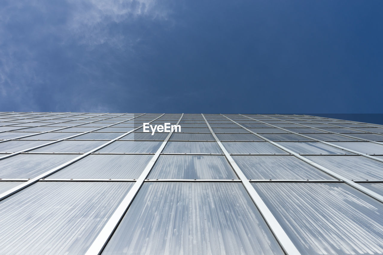 Low angle view of building against blue sky