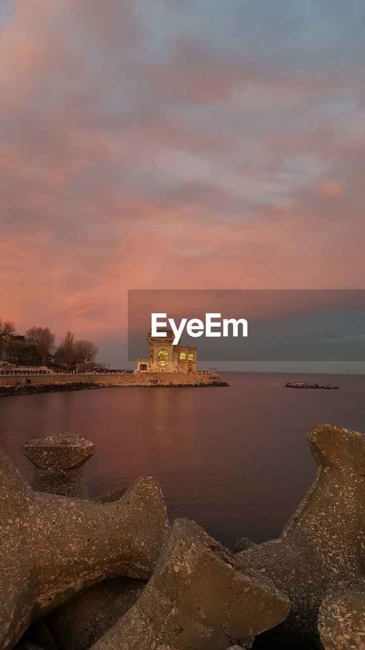 Scenic view of sea against sky during sunset