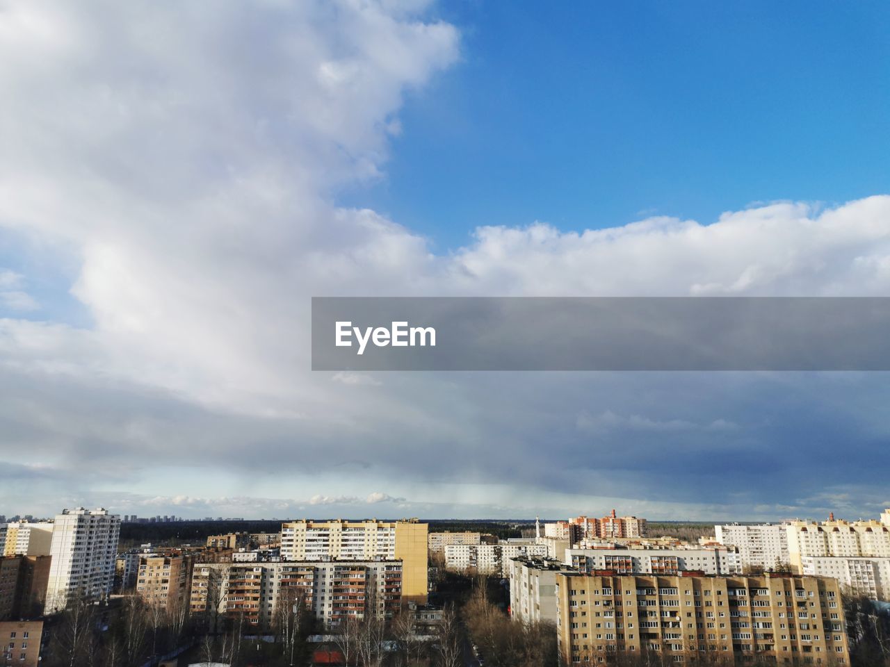 Low angle view of buildings in town against sky