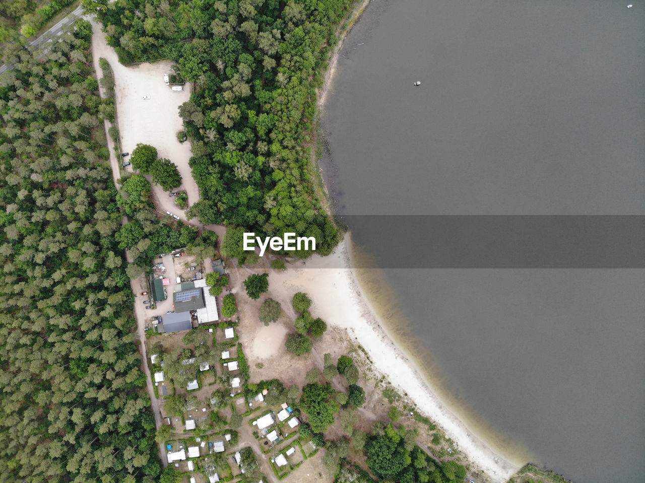 HIGH ANGLE VIEW OF BUILDINGS SEEN THROUGH LAND