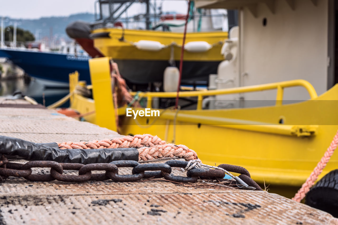 Boats moored at harbor