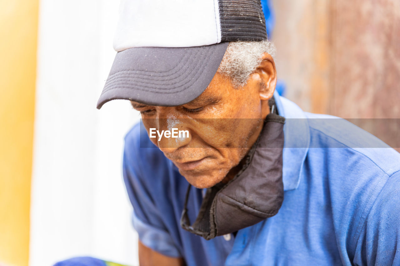 portrait of senior man looking away at home