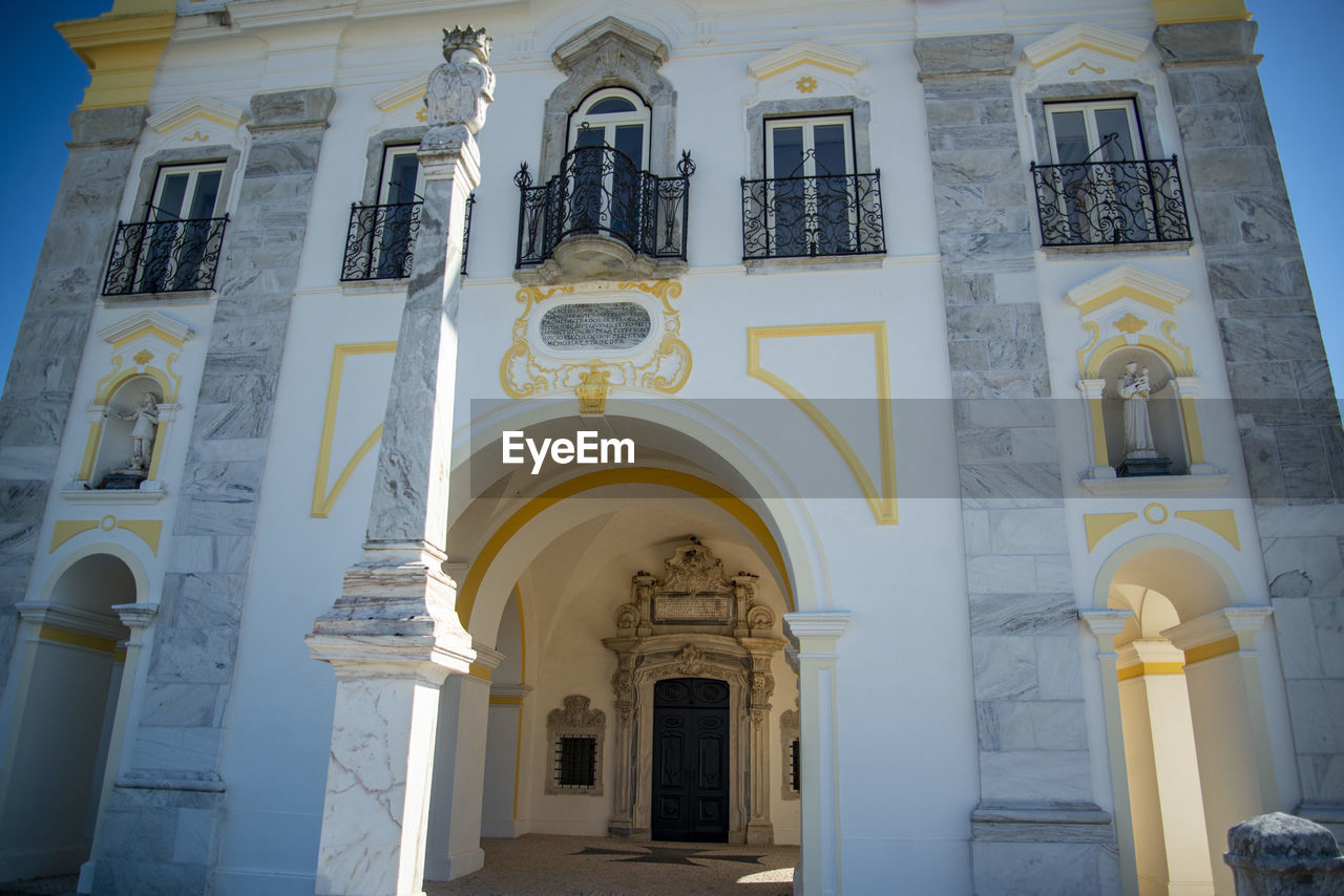 architecture, built structure, building exterior, building, religion, place of worship, arch, belief, spirituality, facade, no people, travel destinations, history, low angle view, the past, catholicism, day, architectural column, outdoors, window, nature, travel, entrance, sky