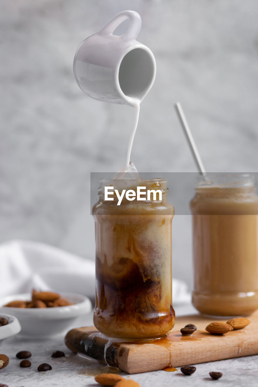 CLOSE-UP OF COFFEE CUP IN WINEGLASS