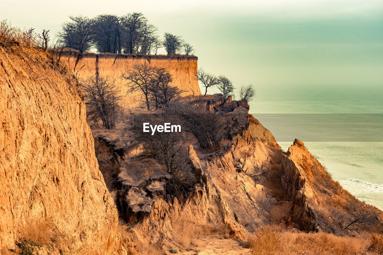 VIEW OF ROCK FORMATION IN SEA