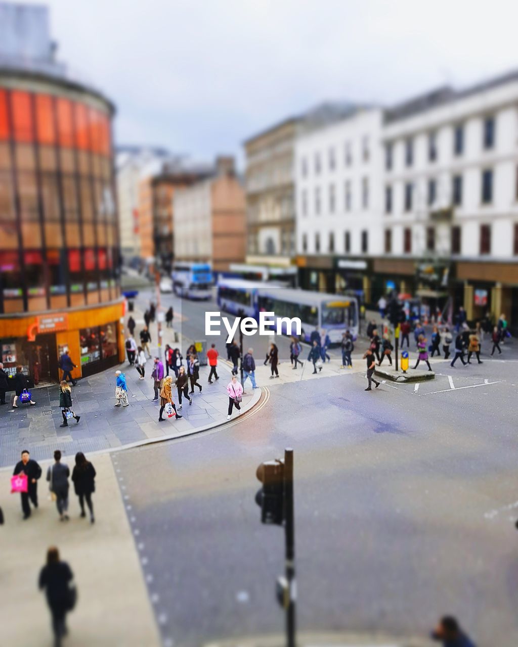 People amidst buildings in city