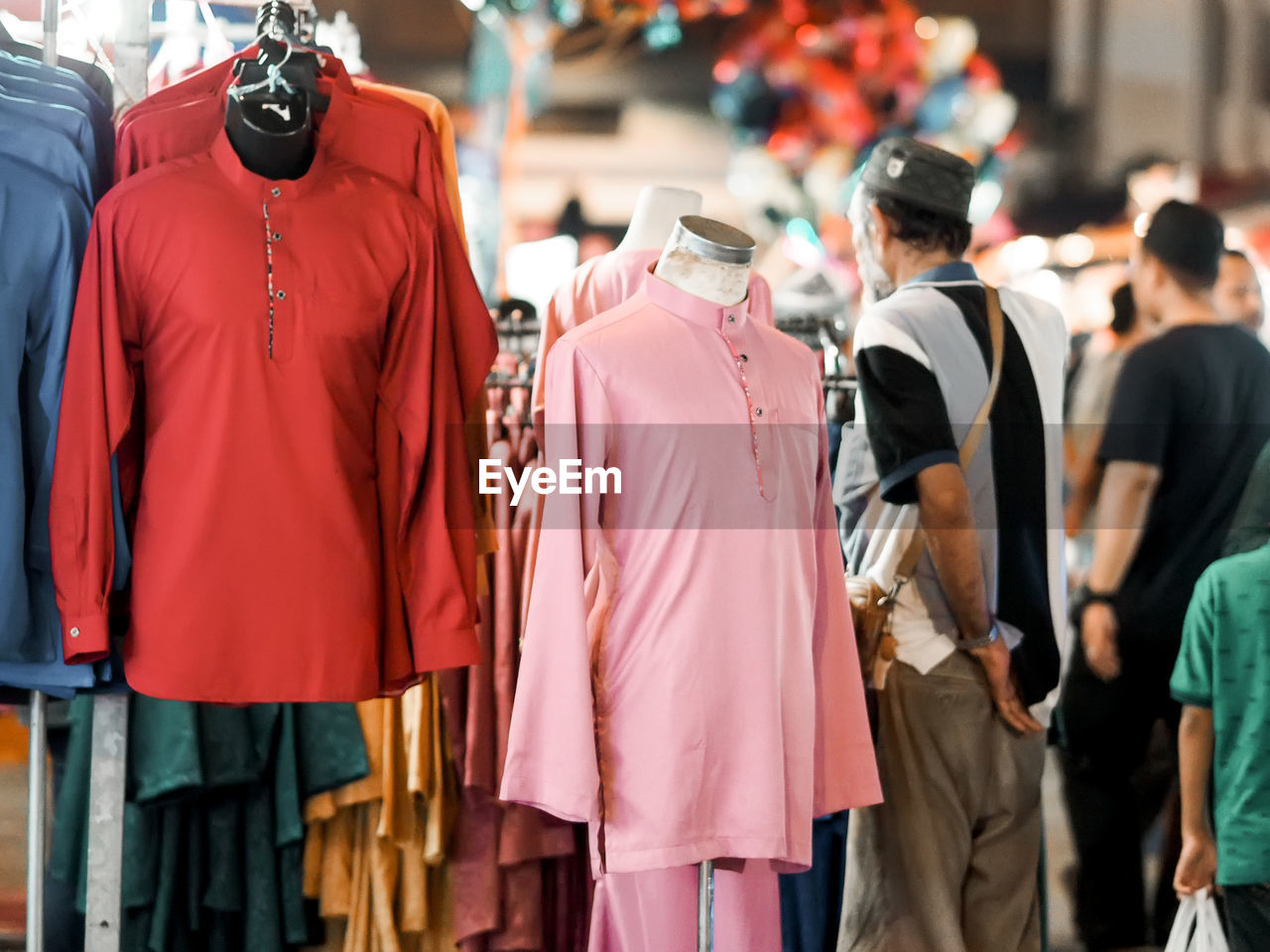 Rear view of people walking in store