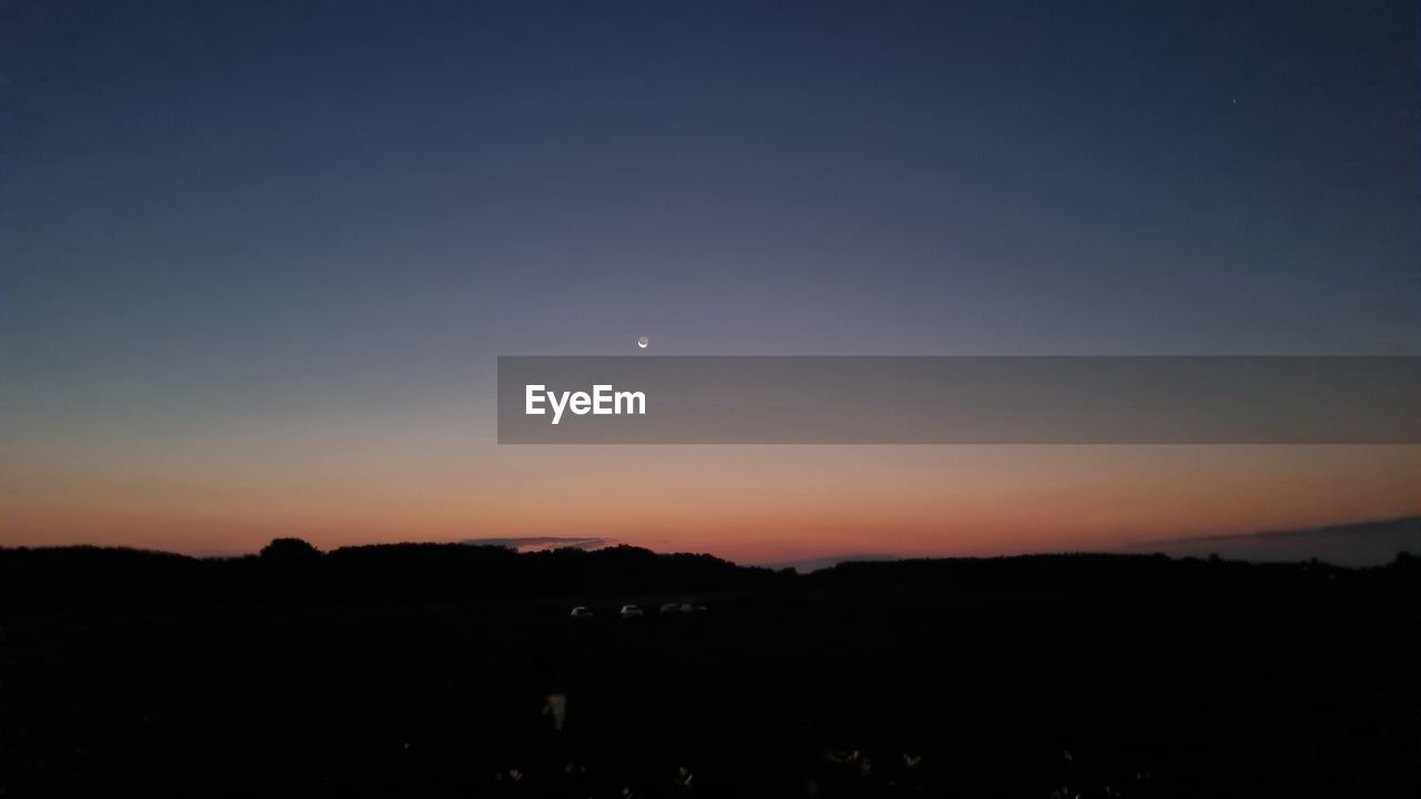 sky, astronomical object, scenics - nature, tranquility, beauty in nature, darkness, nature, reflection, no people, water, night, space, tranquil scene, light, dawn, moonlight, horizon, moon, astronomy, outdoors, cloud, copy space, lake, idyllic