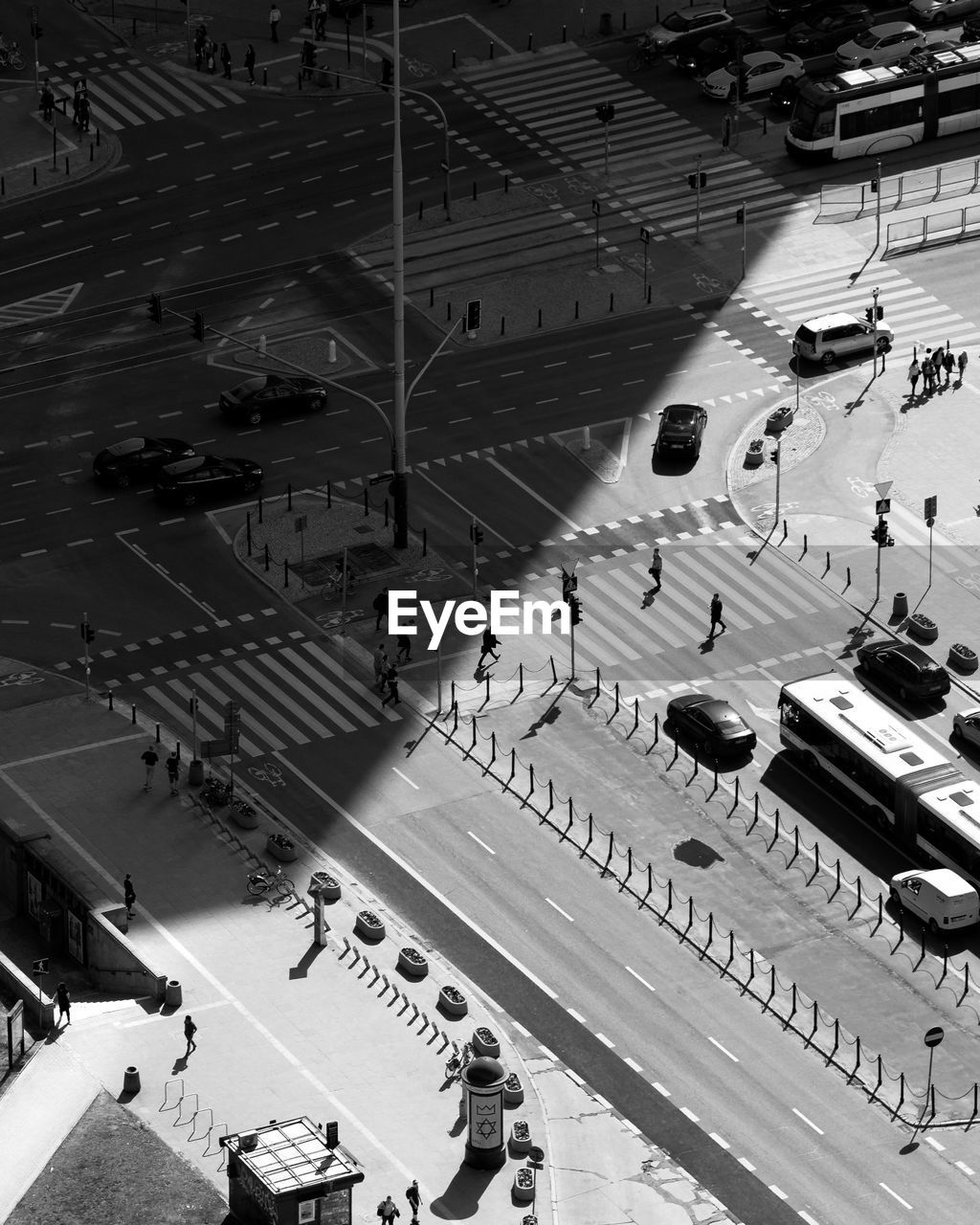 High angle view of people walking on street in city