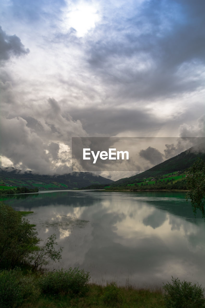 SCENIC VIEW OF LAKE AND CLOUDS AGAINST SKY