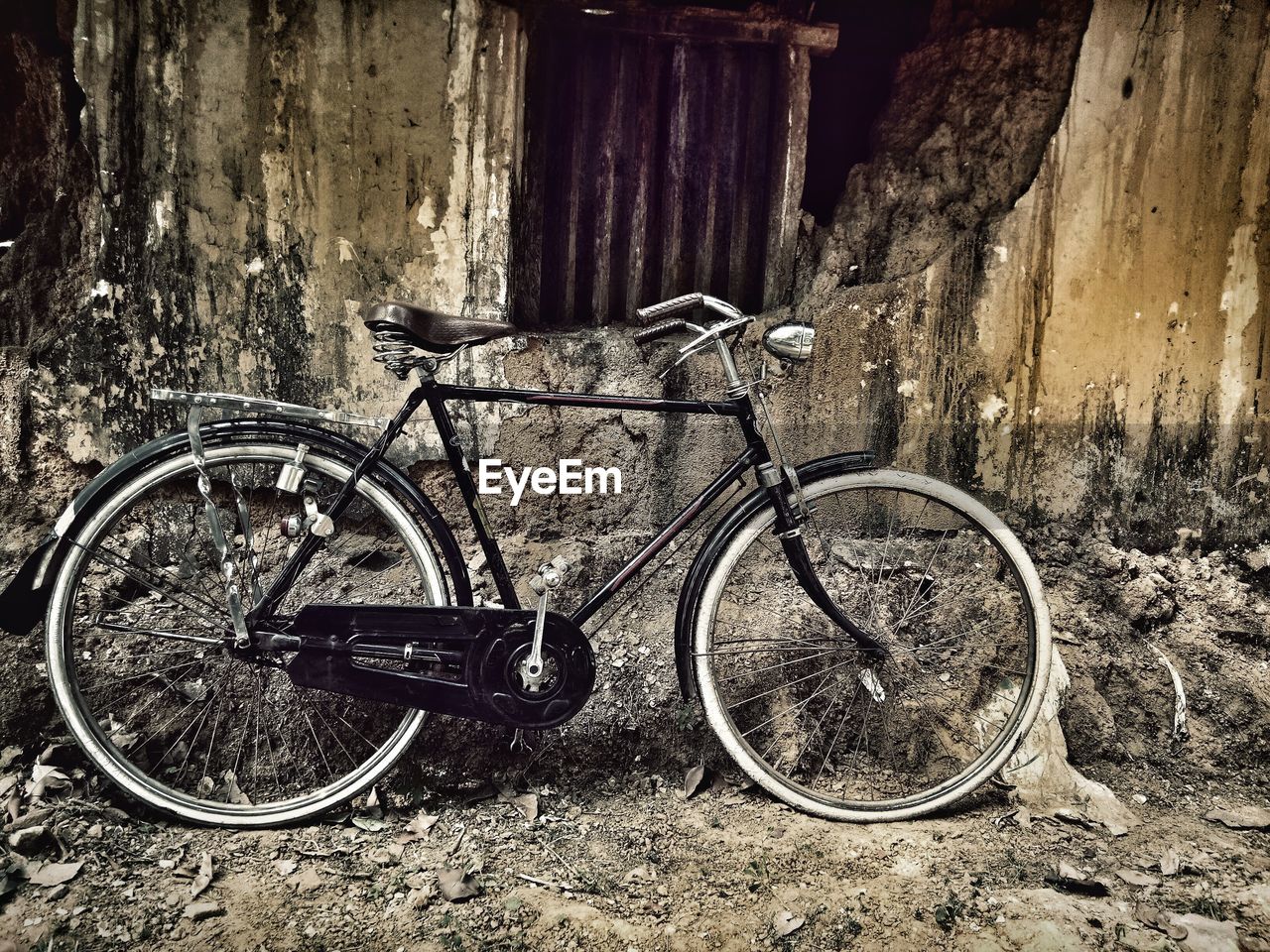 BICYCLE PARKED IN ABANDONED OLD BUILDING