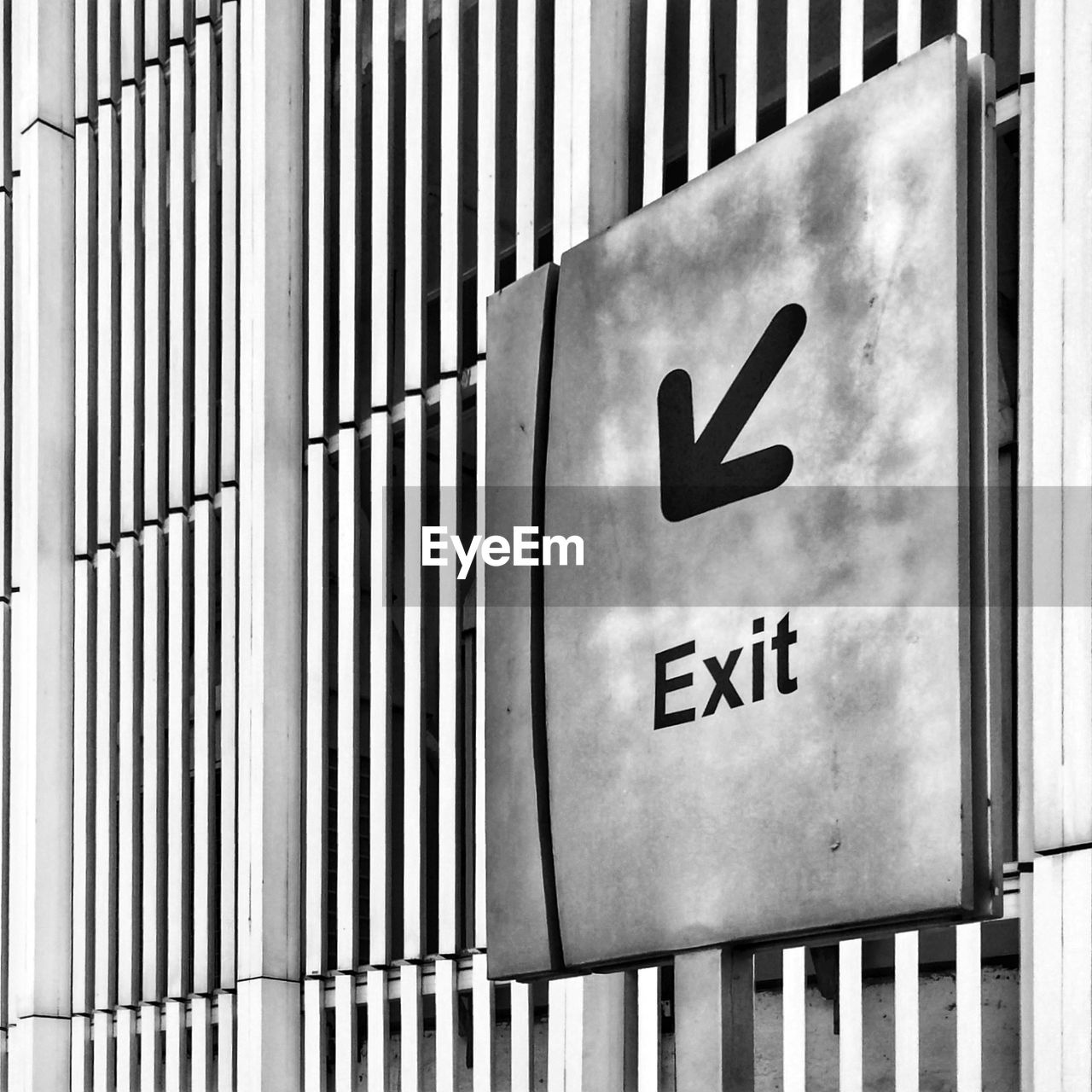 Close-up of exit sign on the wall