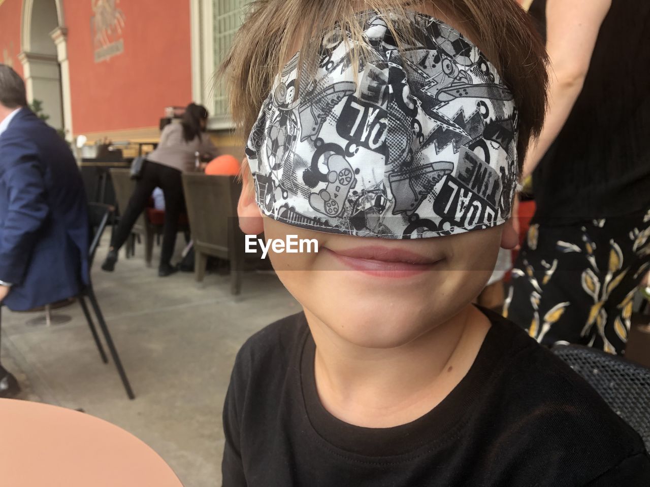 CLOSE-UP PORTRAIT OF BOY WEARING MASK