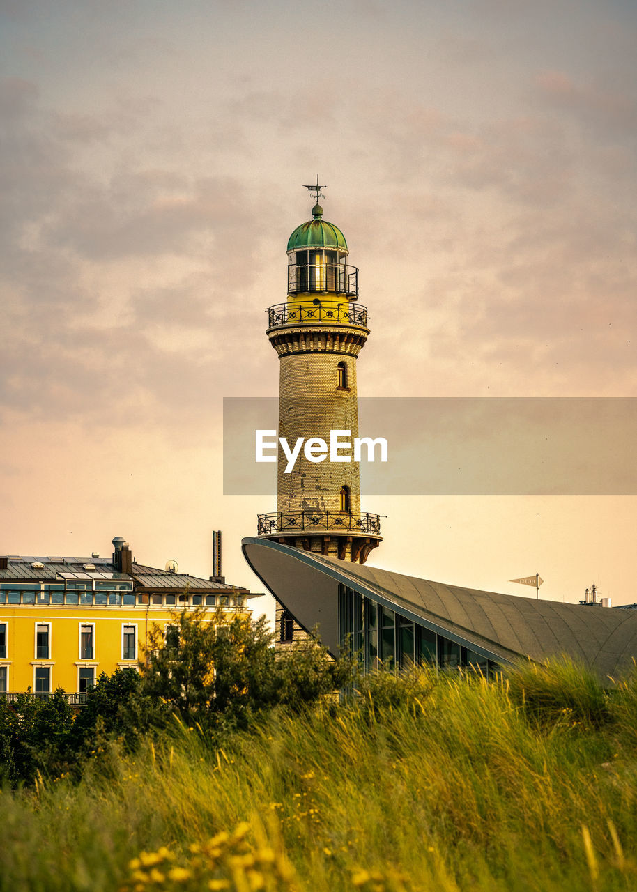 Golden light during sunset on old lighthouse warnemünde