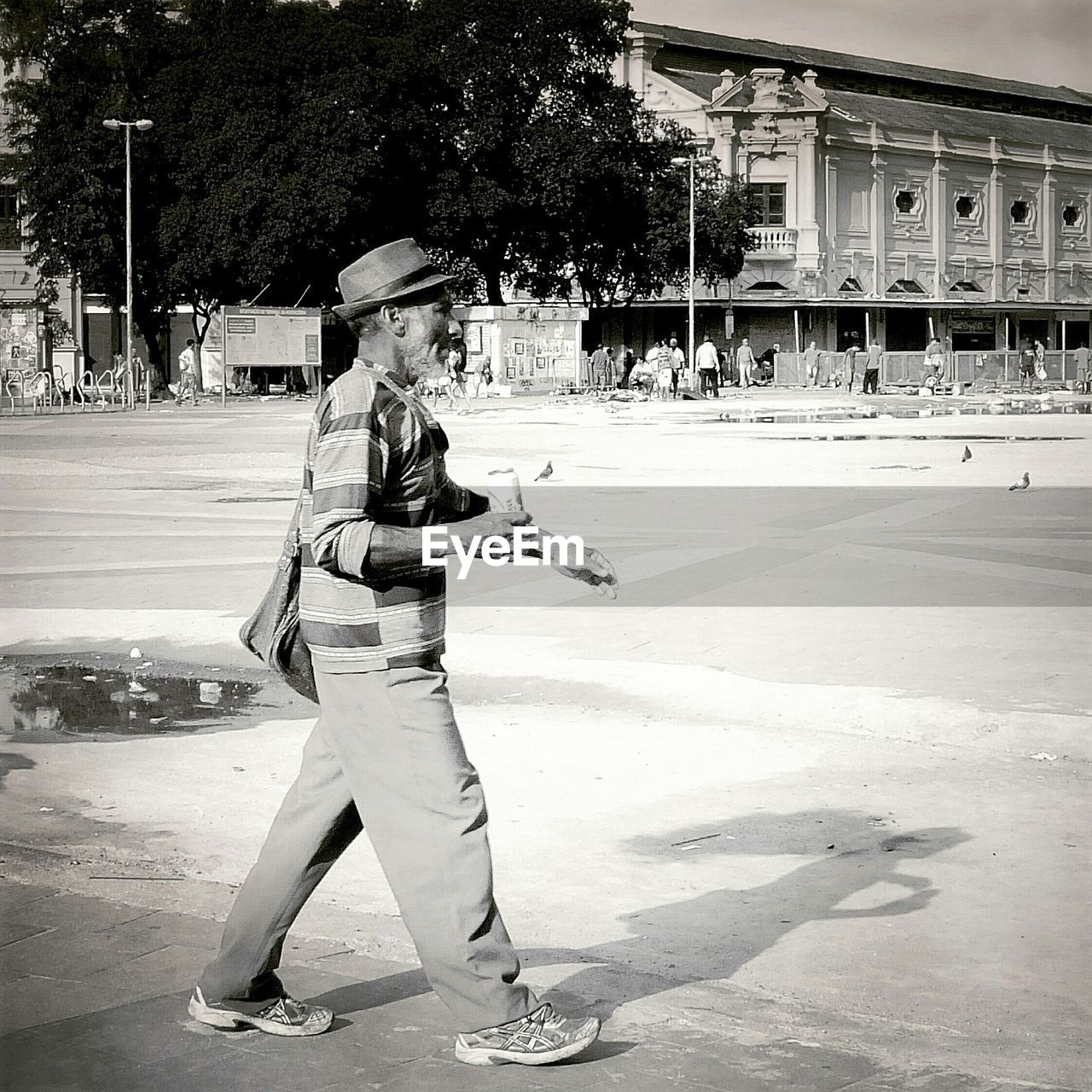 WOMAN STANDING ON RAILING