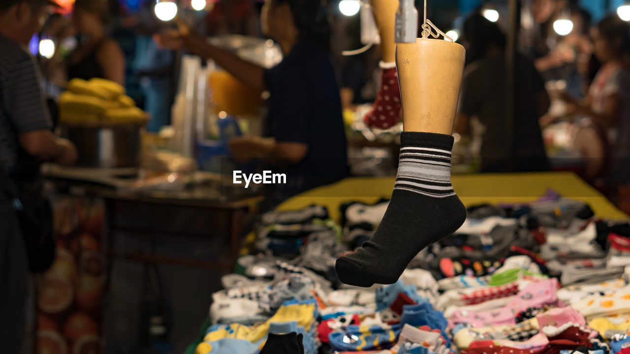 Close-up of socks hanging at market stall