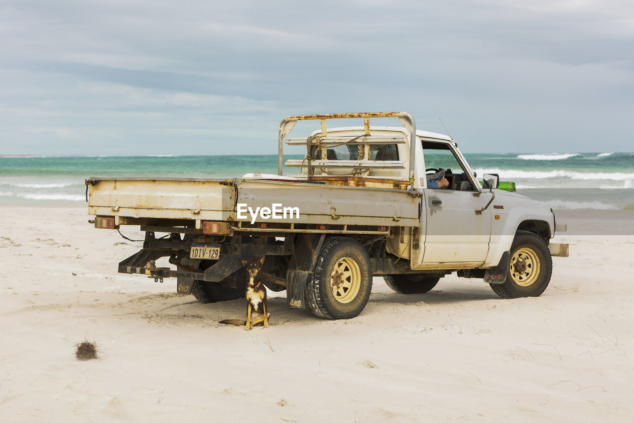 VINTAGE CAR ON BEACH